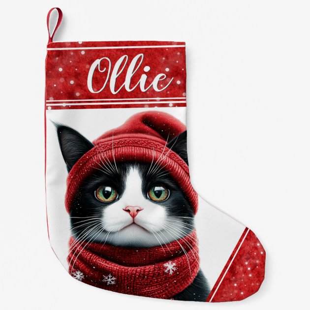 Zazzle product image of a red and white Christmas stocking printed with a black and white cat in a red knit hat and scarf, with the sample name Ollie on the cuff.